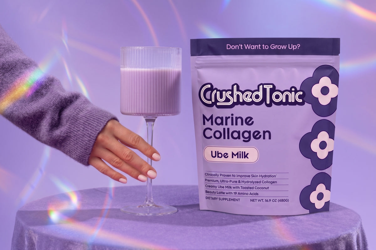 Crushed Tonic Banana Milk collagen pouch beside a glass of banana milk